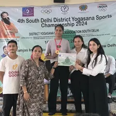 My student Deepa receiving her gold medal at the district level championship. It is an honor to guide such talented and dedicated yogis.