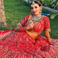 Here is another angle of this stunning red lehenga look, showcasing how the makeup complements the intricate embroidery and heavy jewelry. This is a complete, head-to-toe bridal vision.