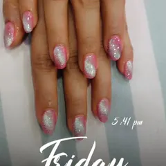 This look is all about the sparkle. I used a pink base with a silver glitter ombre effect, creating a beautiful shimmer on these almond-shaped nails.