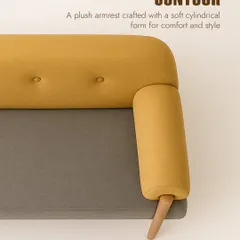 A close-up of the 'Contour' sofa's details. The plush, cylindrical armrest and button-tufted backrest showcase our focus on creating furniture that is comfortable, stylish, and thoughtfully crafted.
