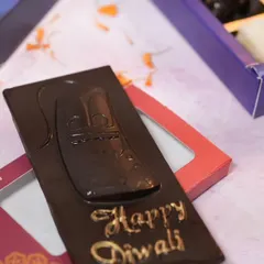 My custom "Happy Diwali" chocolate bar is a simple yet elegant gift. I offer it in delicious flavours like Crunchy Bar, Roasted Almond, and Fruit & Nut to sweeten your festive celebrations.