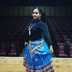 Dressed in a traditional Garba outfit before a New Year's Eve performance. We help you with costume ideas that match the theme of your festive dance.