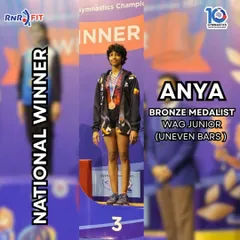 A national champion in the making. This is Anya on the podium after winning a Bronze Medal on the Uneven Bars at the WAG Junior Nationals, a testament to her flawless technique and fearless determination.
