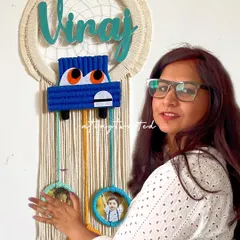 I love bringing your unique ideas to life, like this custom car-themed dreamcatcher nameplate. It features a hand-knotted car and three small frames below to hold precious photos, making it a truly personal piece of art for a child's room.