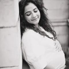 This is a simple, timeless black and white portrait of an expecting mother. My goal here was to capture the peaceful, inward-looking joy that defines pregnancy, creating a classic image she can cherish forever.