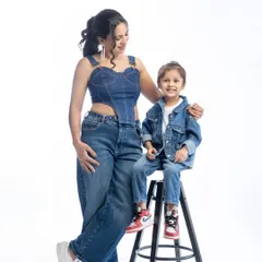 A stylish mother and son duo celebrating his fifth birthday. We love when families bring their own style to our studio sessions, like this cool matching denim look.