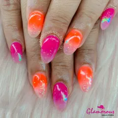 Turn up the volume with this electrifying neon ombré. We blended a hot pink into a bright orange, with a touch of glitter at the tips for extra sparkle. This look is all about being bold, bright, and ready to party.