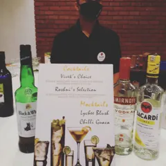 Personalization is key to our wedding service. This custom bar menu features signature cocktails named after the bride and groom, 'Vivek's Choice' and 'Roshni's Selection', alongside our popular mocktails.
