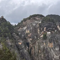 This is the world famous Tiger’s Nest Monastery in Bhutan, seen from the trail. The monastery clings to a sheer cliff face, and the trek to reach it is the main highlight of my 7-day all-inclusive Bhutan trip. The view itself is worth the journey.