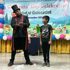 A young volunteer looks on with amazement during a trick. Capturing these moments of pure wonder is a special part of every show.
