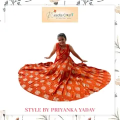 A full view of the custom orange printed dress, designed with a beautiful flare. This outfit is made from a lightweight, breathable fabric, ensuring comfort for all-day wear during celebrations.