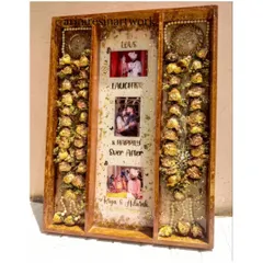 A full view of a large, three-panel varmala preservation frame. This design allows for the entire garlands to be laid out beautifully, with a central panel for photos and personalized text.