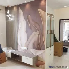 This large-leaf botanical mural adds a touch of modern drama to this living area. Our custom printing ensures the design fits perfectly around the media unit and partition, creating a seamless, high-impact look.