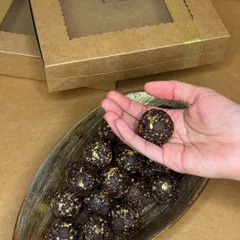 This is the Belgian Chocolate Roasted Almond Ladoo, another one of my healthy festive offerings. It's topped with edible gold leaf for an extra special touch.