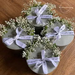 A beautiful way to ask, "Will you be my bridesmaid?". These elegant proposal boxes are adorned with fresh baby's breath and a custom ribbon, creating a truly special moment for your bride tribe.