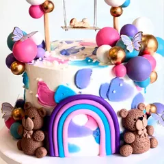 Another detail shot of the swing baby shower cake, showing the cute teddy bears and the pastel rainbow.