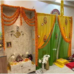A closer look at the pooja mandap setup. I used a lattice screen, marigold torans, and sheer drapes to create a sacred and beautifully decorated corner within the home.