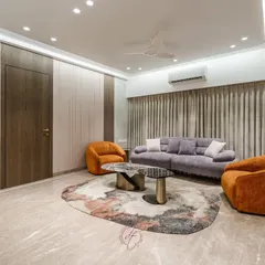 Here, the integrated, self-illuminated display niche is visible, providing an elegant space for artifacts. This view shows how we balance bold furniture choices with sophisticated, built-in architectural details.
