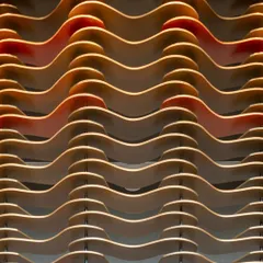 A close-up detail of the modular facade at the Godrej South Estate Experience Centre. The undulating MDF plates, with hints of color on the inner edges, create a captivating play of light, shadow, and texture.