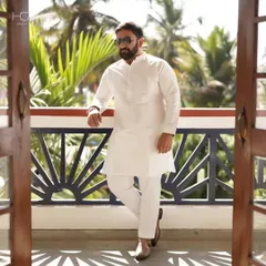 You can’t go wrong with neutral tones, even for ethnic wear. This crisp, all-white kurta set offers a look of timeless elegance, perfect for any celebration.