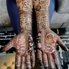 Celebrating the journey to motherhood with personalized baby shower mehndi. This design includes sweet portraits of the parents-to-be, along with adorable baby-themed elements like a toy train and a stork.