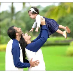A candid moment of pure joy during an outdoor family photoshoot in a Mumbai park. We love capturing these dynamic, natural light portraits that show the playful side of your family's bond.