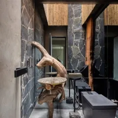 I believe in the honesty of materials. This washbasin, sculpted from a single piece of reclaimed wood, is not just a functional object but a piece of art that tells a story of nature's raw beauty.