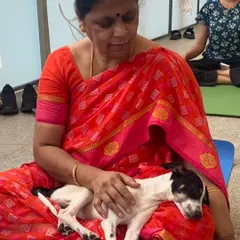Even the most energetic puppies enjoy a moment of calm. This little one found a peaceful lap to rest on during the yoga event.
