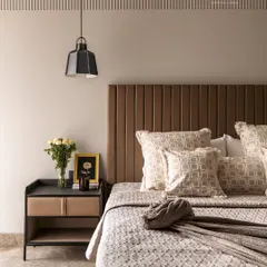 This bedroom is designed as a personal sanctuary. I layered soft neutral tones, rich textures, and modern details, from the vertically channeled headboard to the minimalist pendant light. Every element is chosen to evoke comfort and understated luxury.