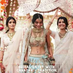 A modern twist on a traditional entry, with the bride walking under a beautiful chaadar held by her bridesmaids.