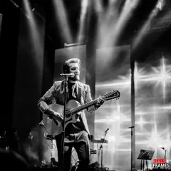 The legendary Atif Aslam, captured in a soulful black and white shot during his performance. We curate evenings filled with musical grace and star power.