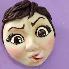 Sometimes you just have to have fun with it! I made this quirky caricature of my own face out of fondant for a collaboration project. It shows that with fondant, you can create any expression you can imagine.
