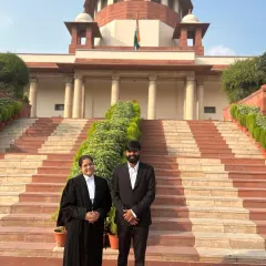 With a colleague outside the Supreme Court. Building a strong professional network is key in the legal field.