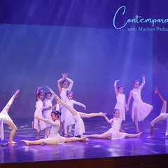 Our young performers in a beautifully composed group pose, showcasing their flexibility and poise. These moments on stage are memories that last a lifetime.