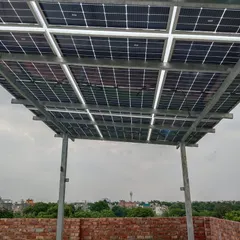 A look from underneath the solar panel array. The sturdy galvanized iron structure is engineered for long term stability and can withstand various weather conditions, protecting your investment.