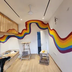 Another angle of the room, showing the full path of the rainbow from one side to the other.