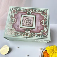 This ornate mint green box opens up to reveal a thoughtfully curated selection of gifts, perfect for surprising a loved one during the festival of lights.