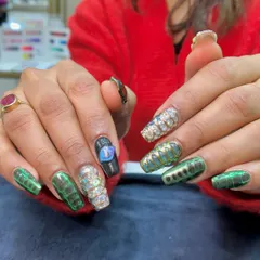 A full view of the 3D snake nail art set. This combines multiple techniques, including chrome, 3D sculpting, and textured effects for a truly wild look.