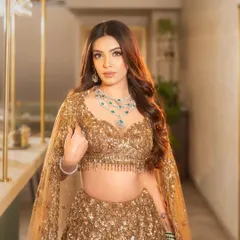 For the bride who wants to shine at her reception or cocktail party. I created these voluminous, soft glam waves to complement this stunning golden lehenga, ensuring she glittered with every step.