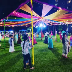 The Dandiya celebration in full swing. Our canopy provides a vibrant ceiling over the community lawn as residents dance, demonstrating how our setups create the perfect environment for festive activities.