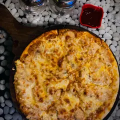 My Alfredo Pizza is pure cheesy goodness on a thin crust. It arrives at your table hot and bubbling, but it never lasts long once everyone grabs a slice.