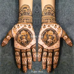 A symmetrical design for Gangour, featuring the sacred 'kalash' (pot) and paisley motifs, symbolizing prosperity and happiness.