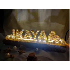 Light up your memories with a personalized LED name stand. I used a client's special varmala flowers to create this glowing 'IKAYA' monogram on a rustic wood base, turning their wedding keepsake into a beautiful piece of home decor.