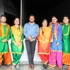 My team and I with the full troupe of performers in colorful Bhangra attire for the Vatika Company Award Show. We provide professional background dancers to create a grand, stage-filling production.