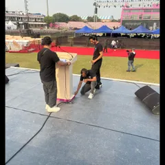 Our crew meticulously setting up and securing cables for the podium at the Khelo India University Games. Safety and technical precision are our top priorities during setup.
