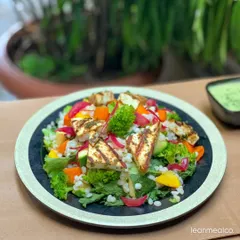 This is our signature Superfood Salad, loaded with grilled paneer, fresh broccoli, barley, and vibrant veggies. It's a complete, nutrient-dense meal designed to keep you energized throughout the day.