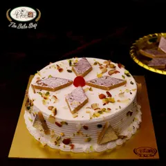 Our Kaju Katli Cake is the perfect blend of nutty and sweet. A rich, creamy cake base is decorated with pieces of traditional kaju katli, toasted nuts, and a single cherry for a classic finish.