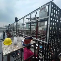 Another angle of the rooftop framework construction. You can see the empty vertical garden modules being attached to the large metal structure before the plants are added.