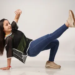 A dynamic pose captured during a studio photoshoot. This move combines flexibility and strength, core elements I focus on in my dance training.