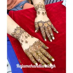 Another example of coordinated guest mehandi. The designs are different but share similar floral and hanging elements, creating a cohesive look for the bridesmaids or family members.
